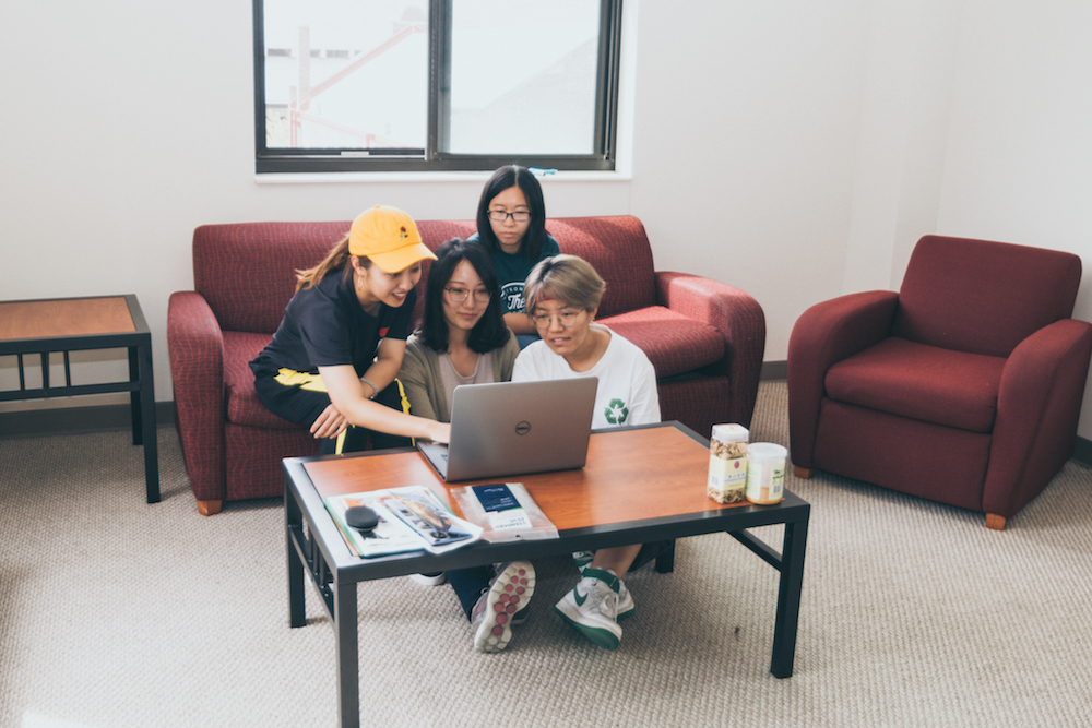 College roommates working on schoolwork together